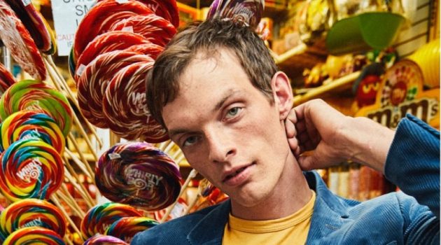 Rocky Takes to Candy Shop in Todd Snyder x Looney Tunes Collection Embracing a pop of color, Rocky Harwood wears a Todd Snyder + Champion + Looney Tunes gang tee $88 in warm gold.