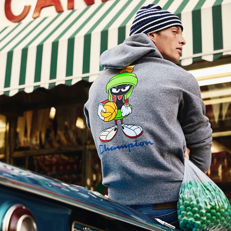 Taking to the streets of New York City, Rocky Harwood sports a Todd Snyder + Champion + Looney Tunes Marvin the Martian hoodie $198 in salt and pepper.