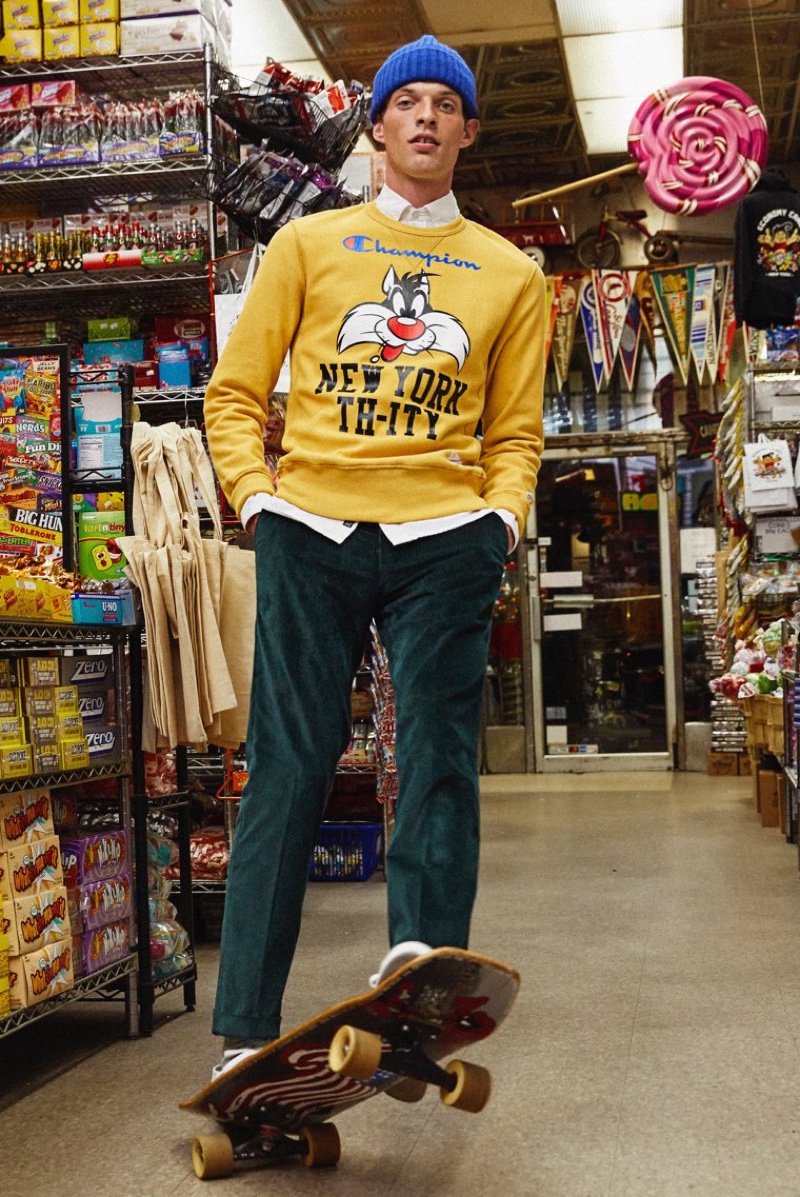 Rocky Harwood sports a Todd Snyder + Champion + Looney Tunes New York Th-ity reverse weave sweatshirt $178 in warm gold.