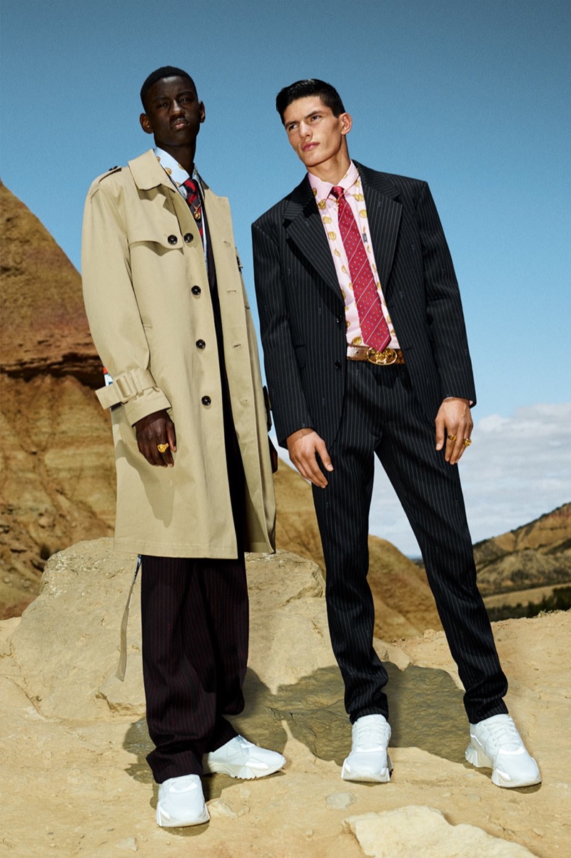 Models Soulemane Tounkara and Islam Dulatov wear relaxed tailoring from Versace's cruise 2020 collection.