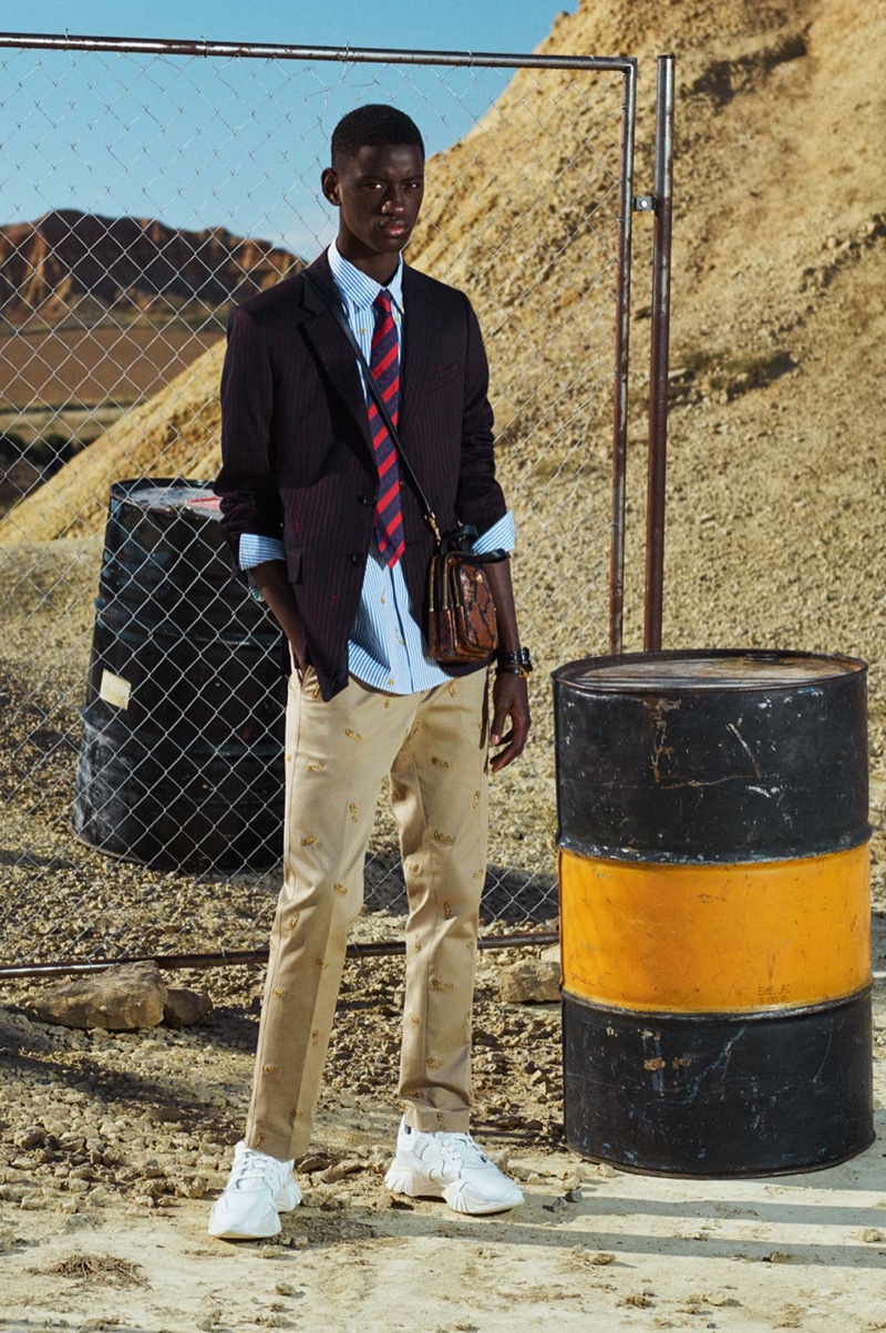 Embracing preppy style, Soulemane Tounkara showcases smart pieces from Versace's cruise 2020 collection.