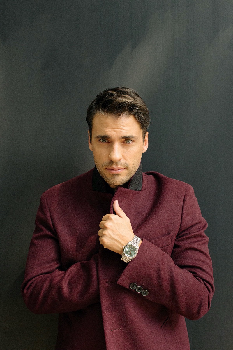 Gracing the pages of Vogue Hombre, Jorge Viladoms sports a Hugo Boss coat with a Rolex watch.