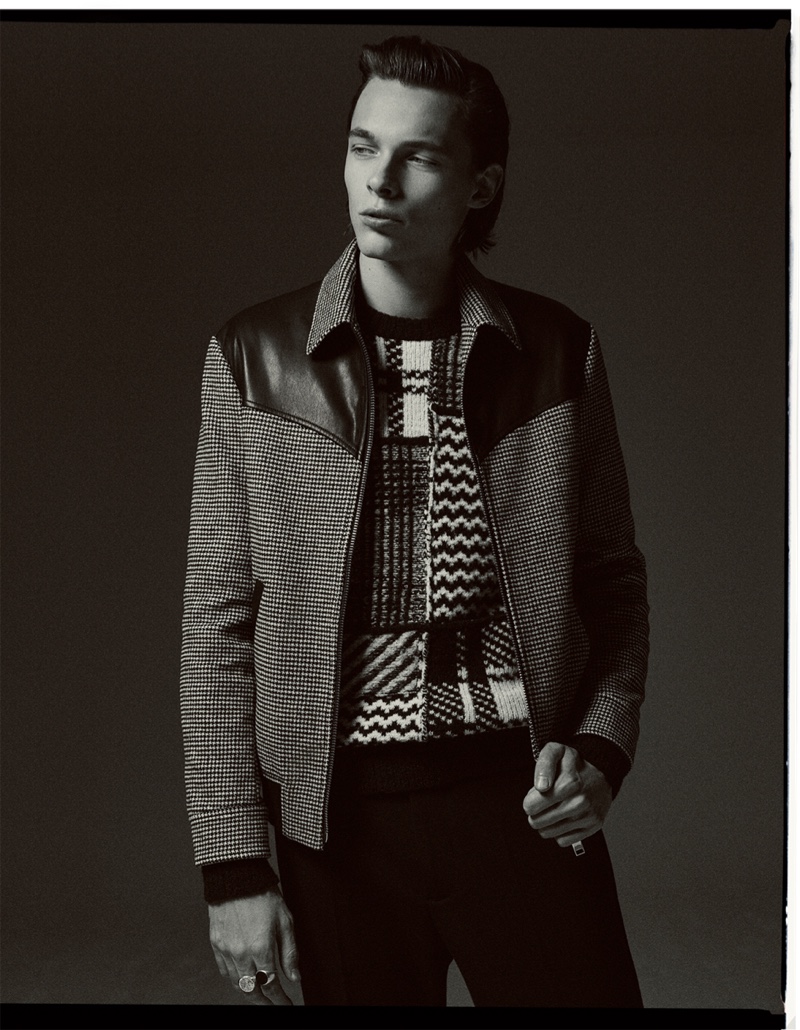 Model Marcel Korusiewicz sports a blouson jacket with knitwear by Zara.