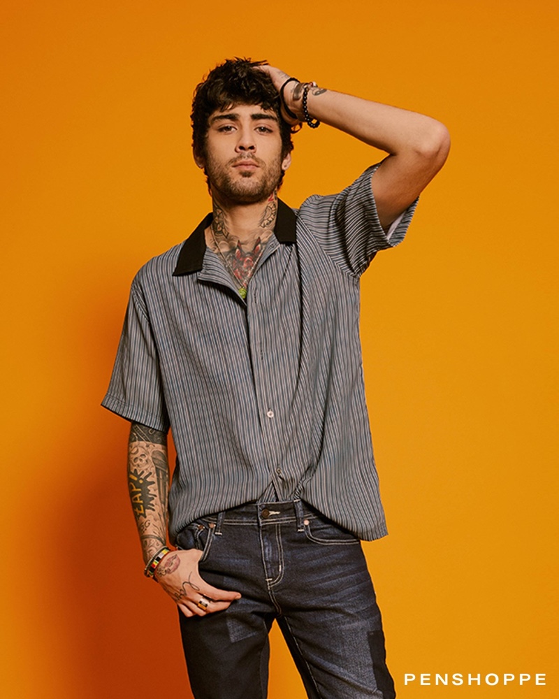 Front and center, Zayn Malik sports a retro-inspired short-sleeve shirts with denim from Penshoppe.