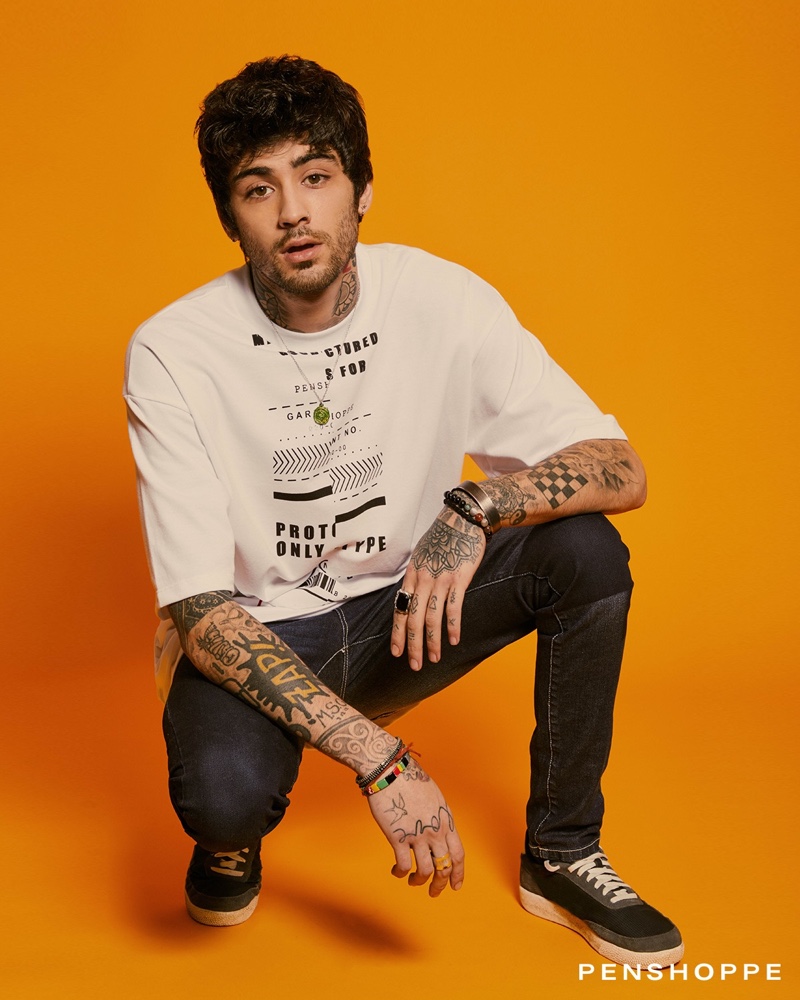 Making a case for casual style, Zayn Malik wears a Penshoppe tee with dark jeans.