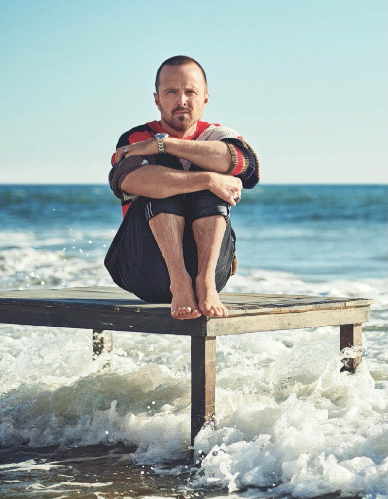 Actor Aaron Paul dons a BOSS sweater with UNIQLO jeans for Men's Journal.