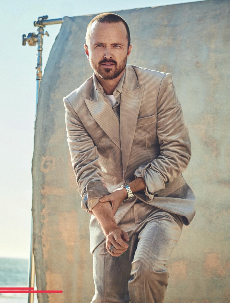 Front and center, Aaron Paul wears a Dzojchen shirt and suit with a Dunhill t-shirt for Men's Journal.