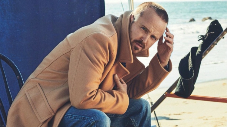 Starring in a photo shoot for Men's Journal, Aaron Paul sports a Mr P. coat, The Workers Club Denim Jeans, and Kenneth Cole boots.