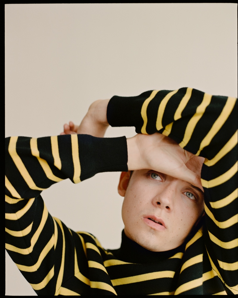 Donning a striped sweater by Stella McCartney, Asa Butterfield stars in a shoot for The Laterals.