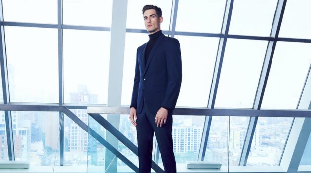 Jason Anthony Sports Navy BOSS Style for Bloomingdale's Jason Anthony dons a navy BOSS suit with a black turtleneck for Bloomingdale's.