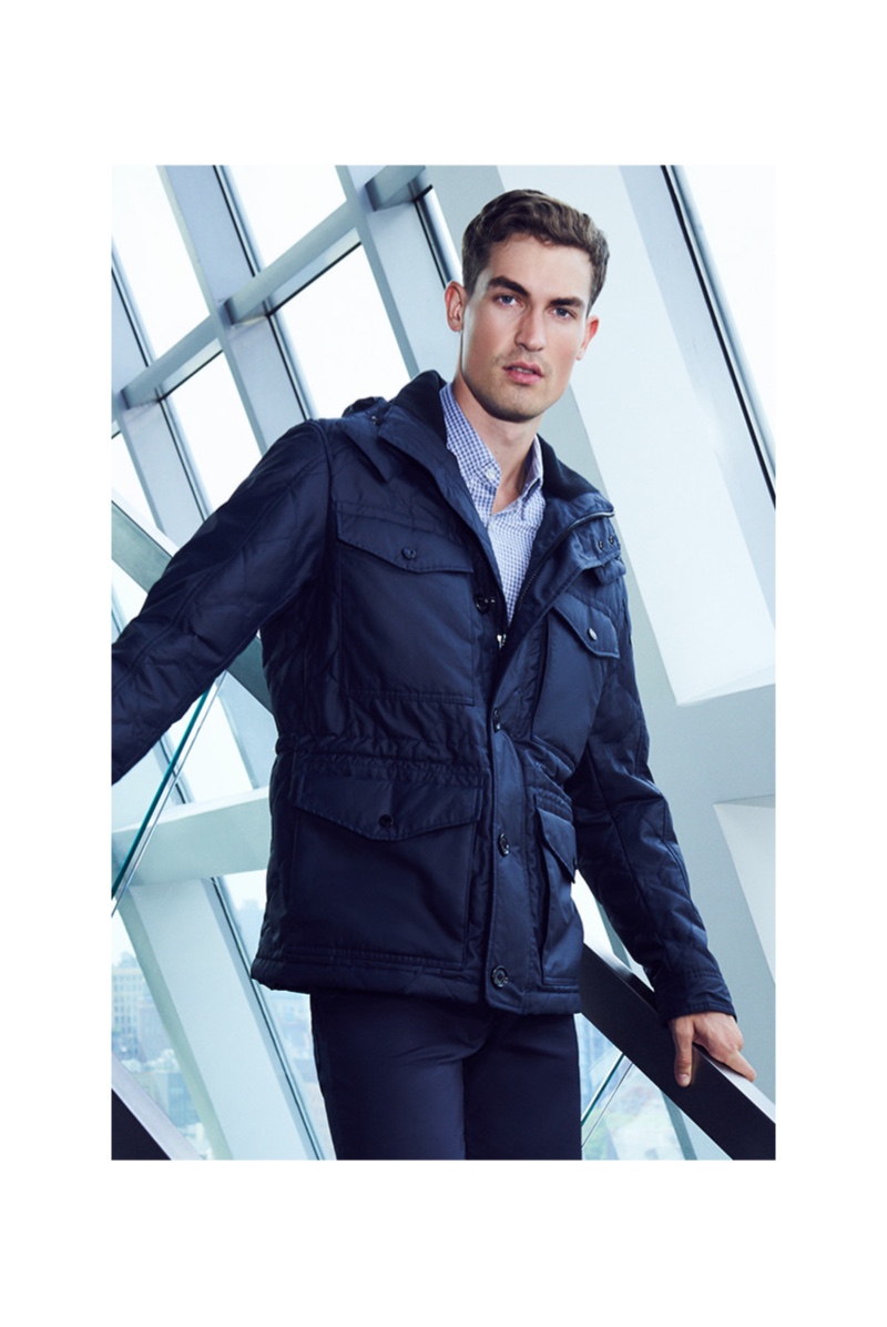 Model Jason Anthony goes semi-casual in a navy look from BOSS for Bloomingdale's.