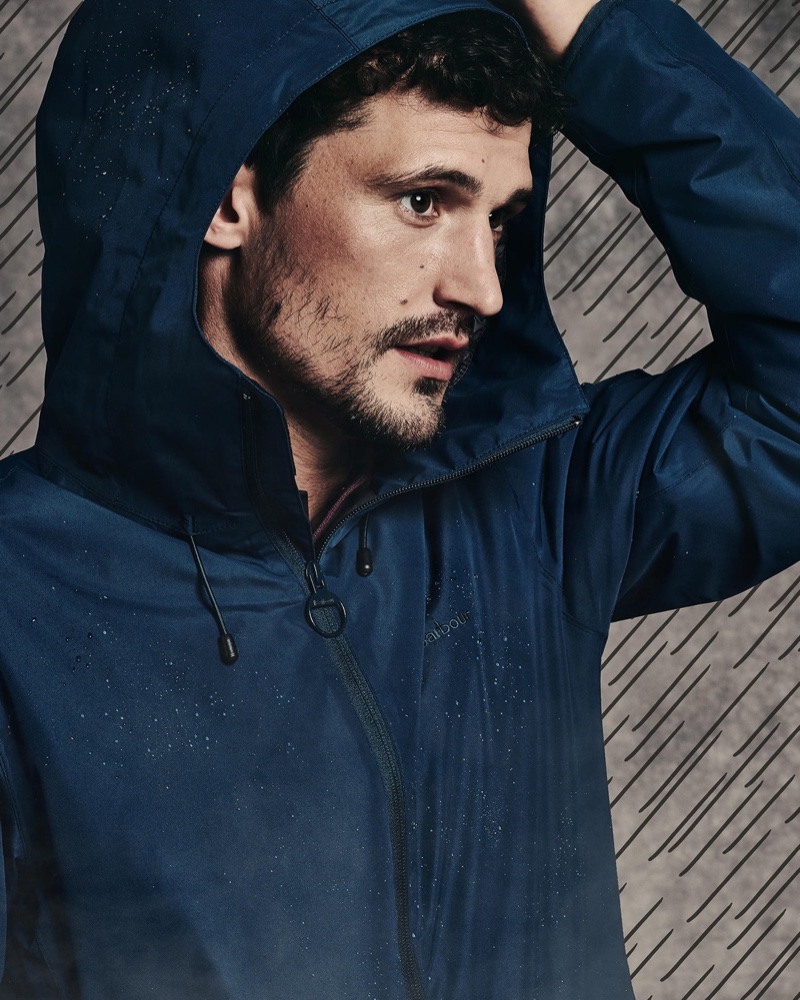 British model Sam Webb sports a hooded jacket by Barbour.