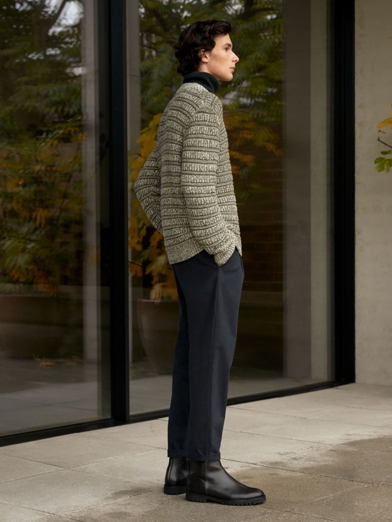 A smart vision, Anton Jaeger dons a sweater and trousers from COS.