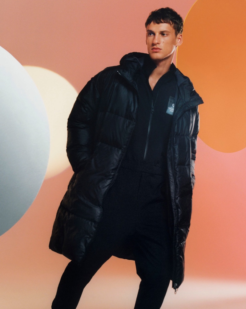 Model David Trulik sports a puffer coat for Calvin Klein's holiday 2019 campaign.