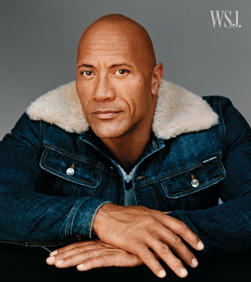 Sitting for a portrait, Dwayne "The Rock" Johnson wears a Dolce & Gabbana denim jacket with a Todd Snyder sweater for WSJ. magazine.