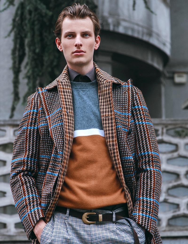 Thomas wears shirt Corneliani, sweater and belt Eleventy, coat Drumohr, and coat Canali 1934.