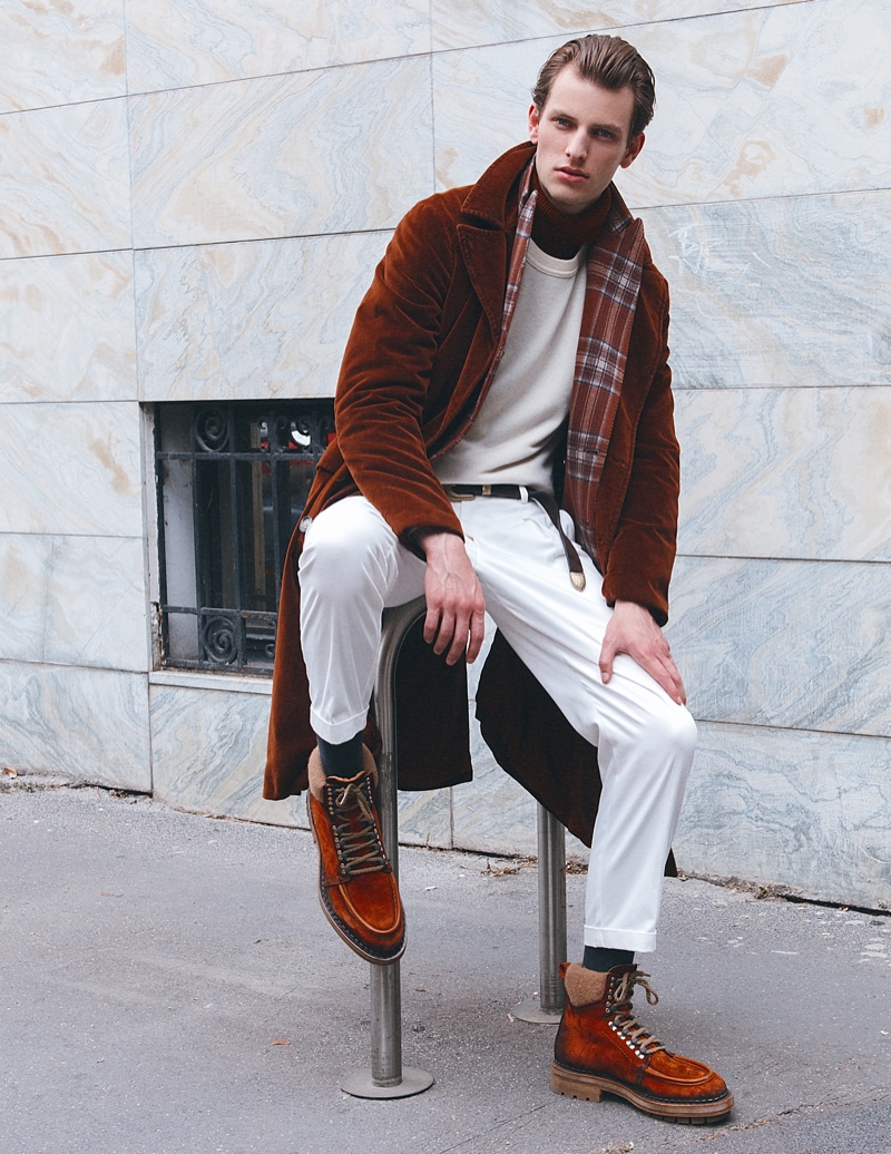 Thomas wears turtleneck Massimo Alba, sweater Siviglia, pants Marsem, jacket Corneliani, coat Massimo Alba, and boots Santoni.