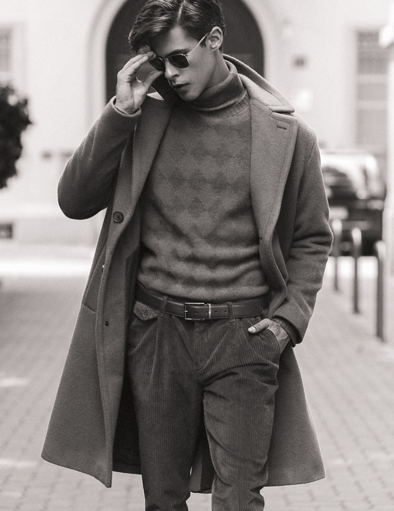 Oyvind wears turtleneck Marina Militare, sweater Cividini, pants Re-Hash, coat Hevo, belt Caporiccio, and sunglasses Maui Jim.