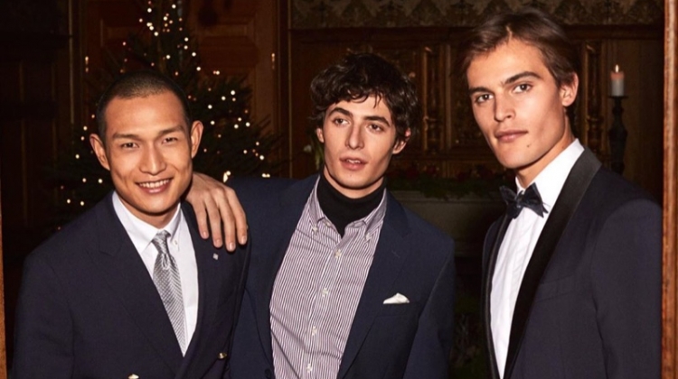 Models Zhang Wenhui, Oscar Kindelan, and Parker van Noord dress up for GANT's holiday 2019 campaign.