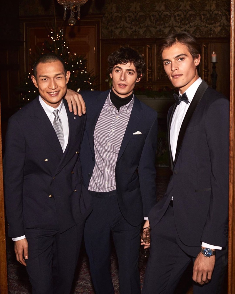 Models Zhang Wenhui, Oscar Kindelan, and Parker van Noord dress up for GANT's holiday 2019 campaign.