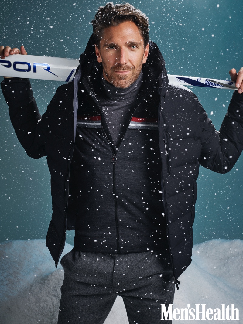 Front and center, Henrik Lundqvist dons a Herno hooded puffer jacket, Zegna sweater, UNIQLO Heattech turtleneck, and Banana Republic joggers. 