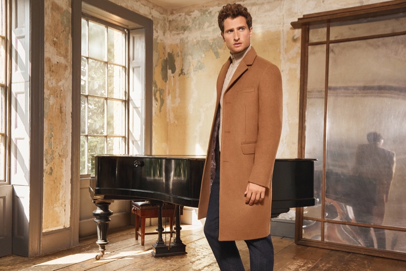 Tom Warren dons a classic camel coat for Jaeger's fall-winter 2019 campaign.