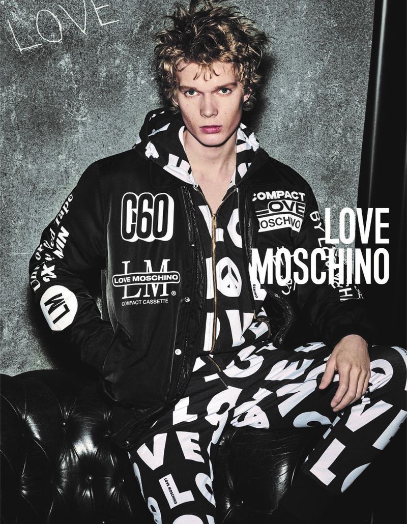 Sporting a graphic black and white look, Aaron Sirainen stars in LOVE Moschino's fall-winter 2019 campaign.
