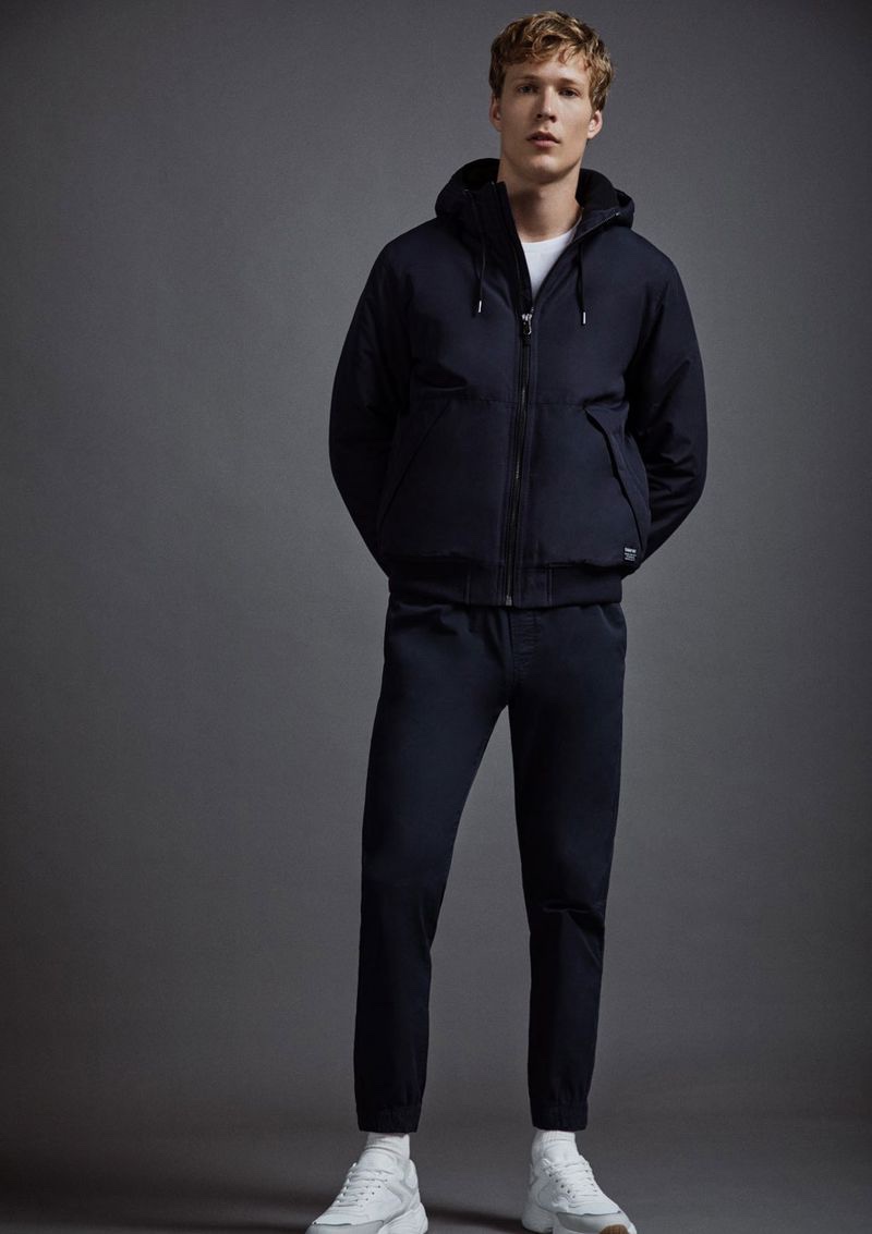 Going sporty, Sven de Vries rocks a hooded jacket with pants from Lefties. 