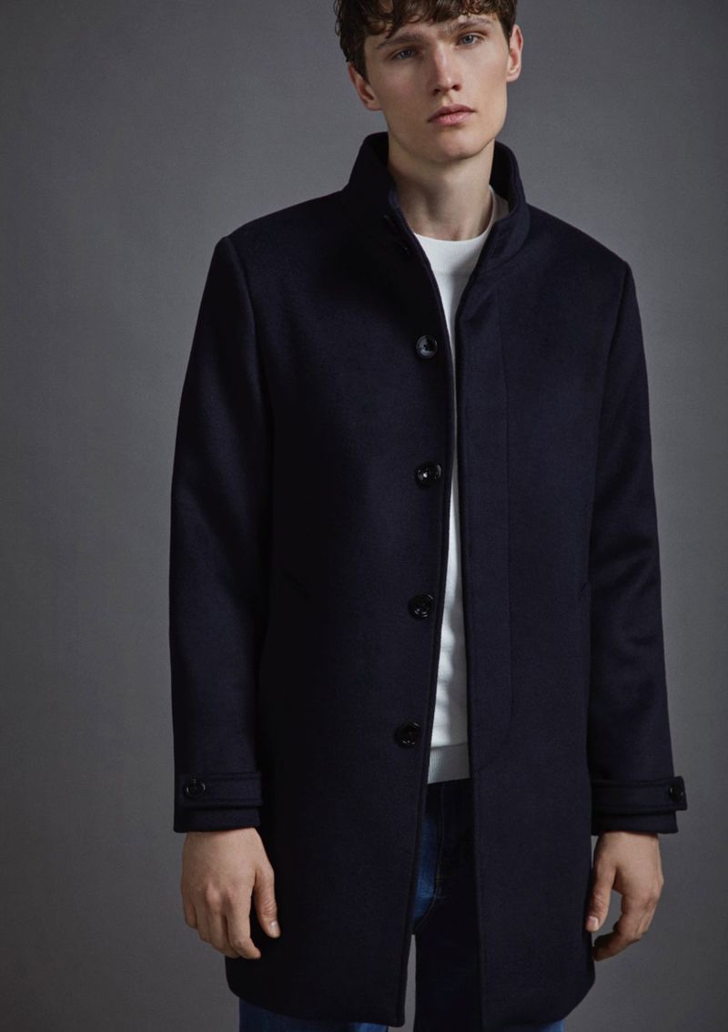 Model Lukas Marschall dons a sleek navy coat from Lefties.
