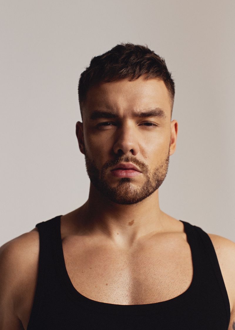 Sporting a black tank, singer Liam Payne stars in a new photo shoot for Têtu.