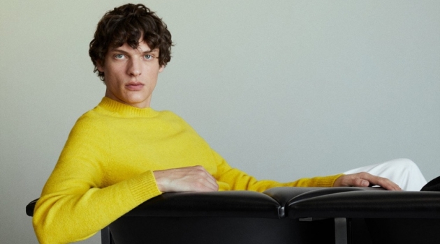Making a splash in yellow, Valentin Caron wears a Mango sweater.
