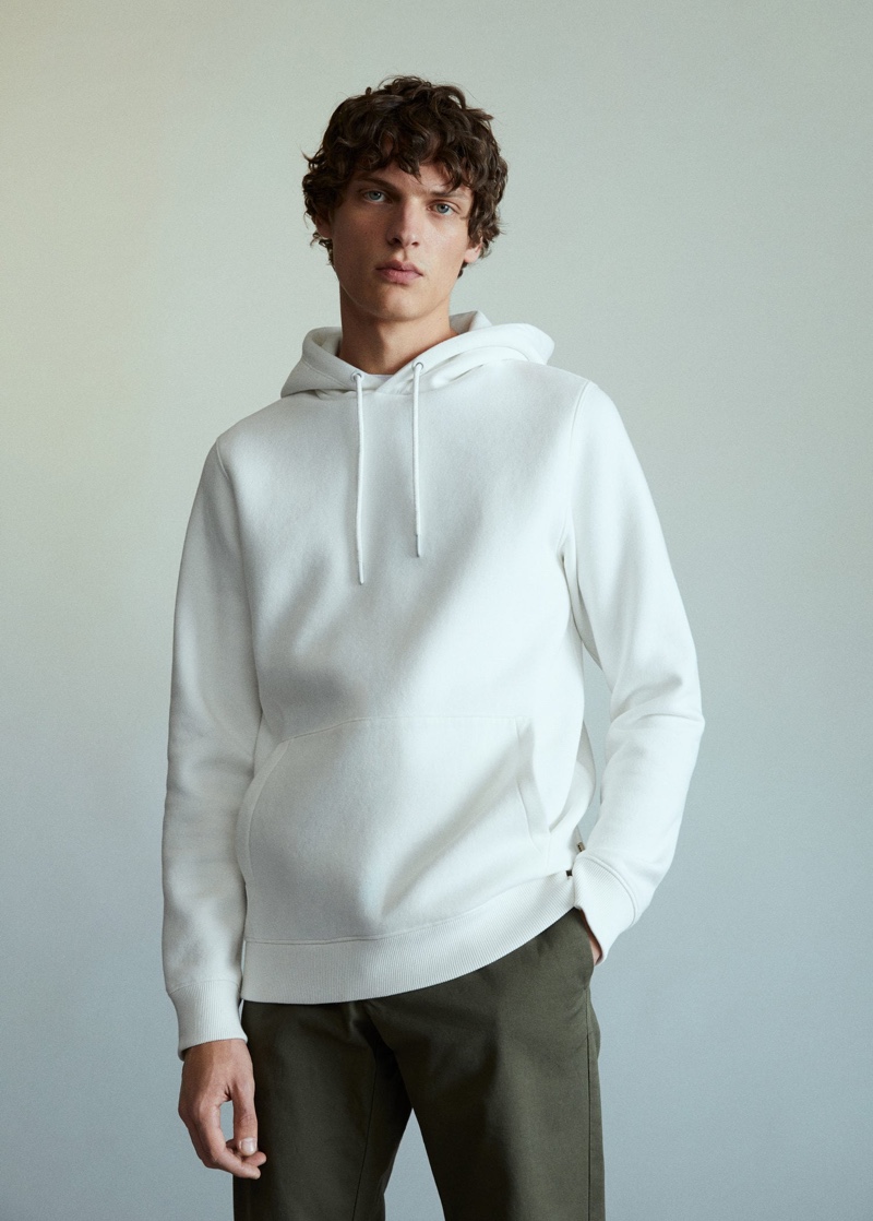 Sporting essentials from Mango, Valentin Caron wears must-haves like the hoodie.