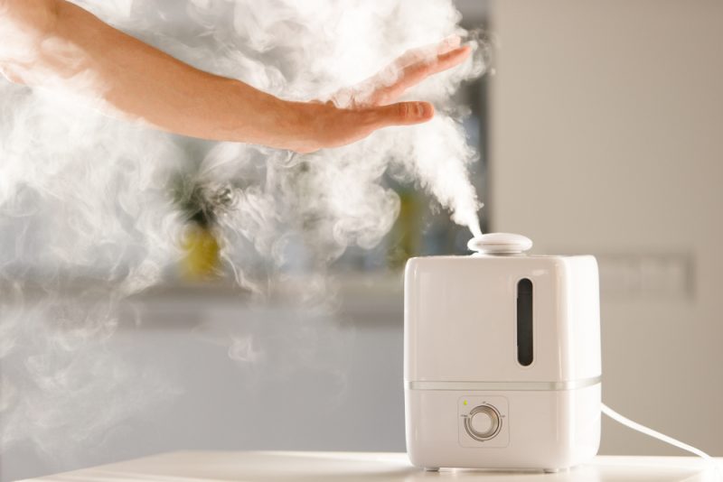 Mans Hand Over Humidifier