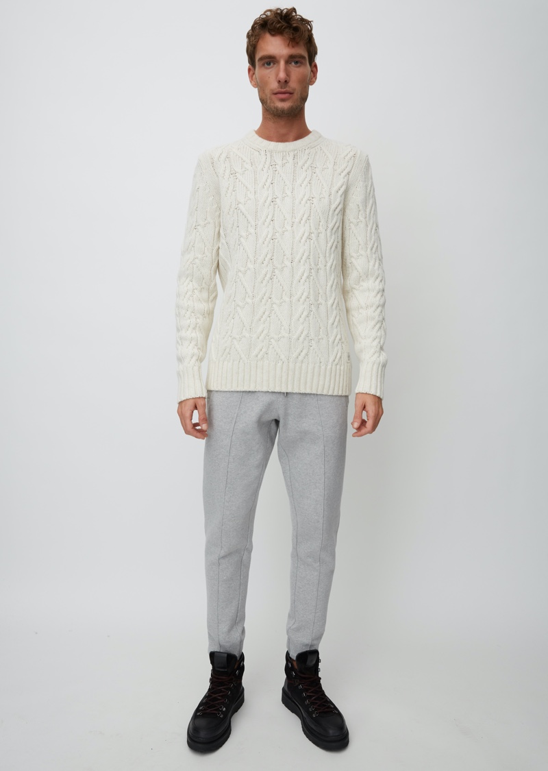 Sporting a cable-knit sweater, Nikola Jovanovic fronts the outing for Marc O'Polo's Christmas collection.