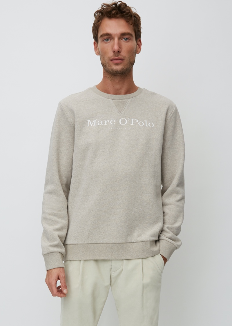 Front and center, Nikola Jovanovic sports a logo sweatshirt from Marc O'Polo's Christmas collection.