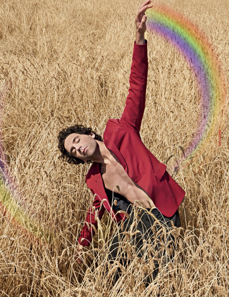 Taking to a field with Vanity Fair Italia, Mika sports a Berluti suit jacket with vintage pants.