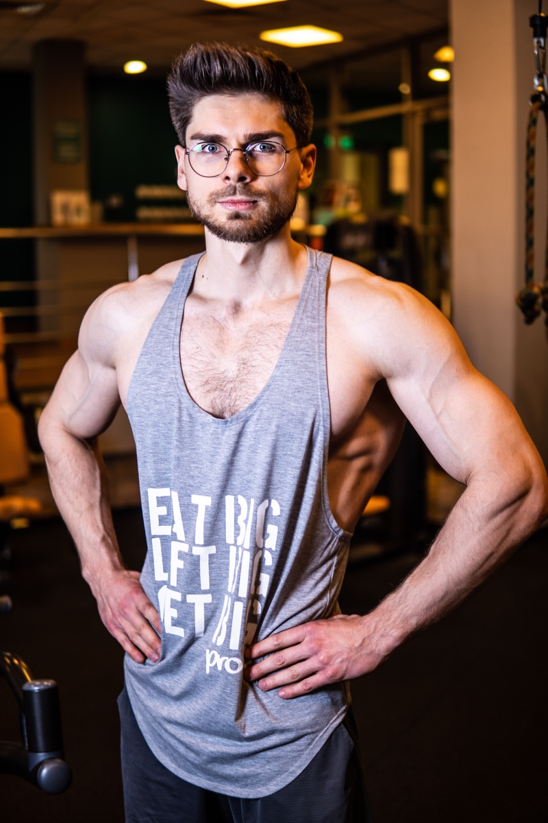 Muscular Man at Gym Wearing Glasses