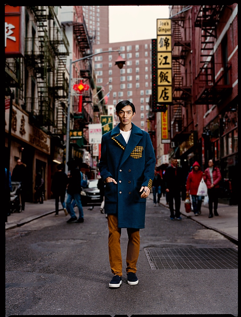 Naoki wears shirt Tommy Hilfiger, pants Alberto, jacket Odd Natives, shoes ONEGROUND, and ring Jill Herlands. 