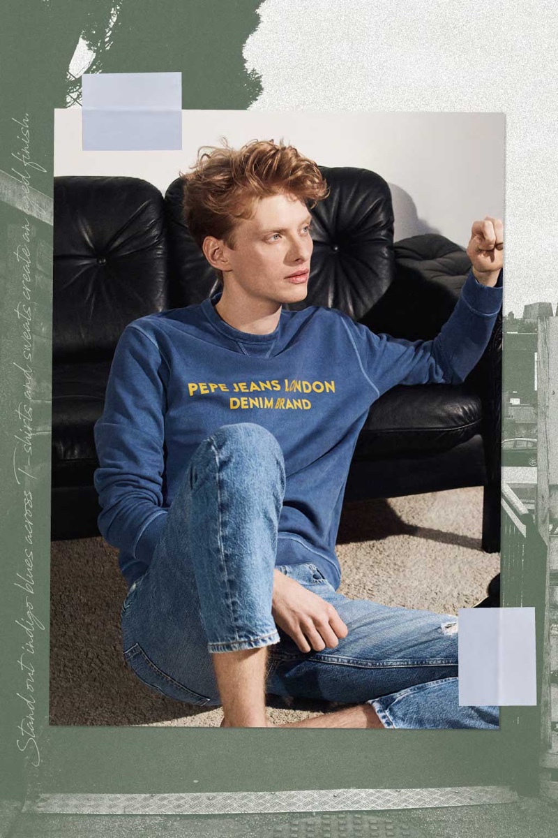 Model Iwan Zalewski relaxes in a sweatshirt and jeans from Pepe Jeans' pre-spring/summer 2020 collection.