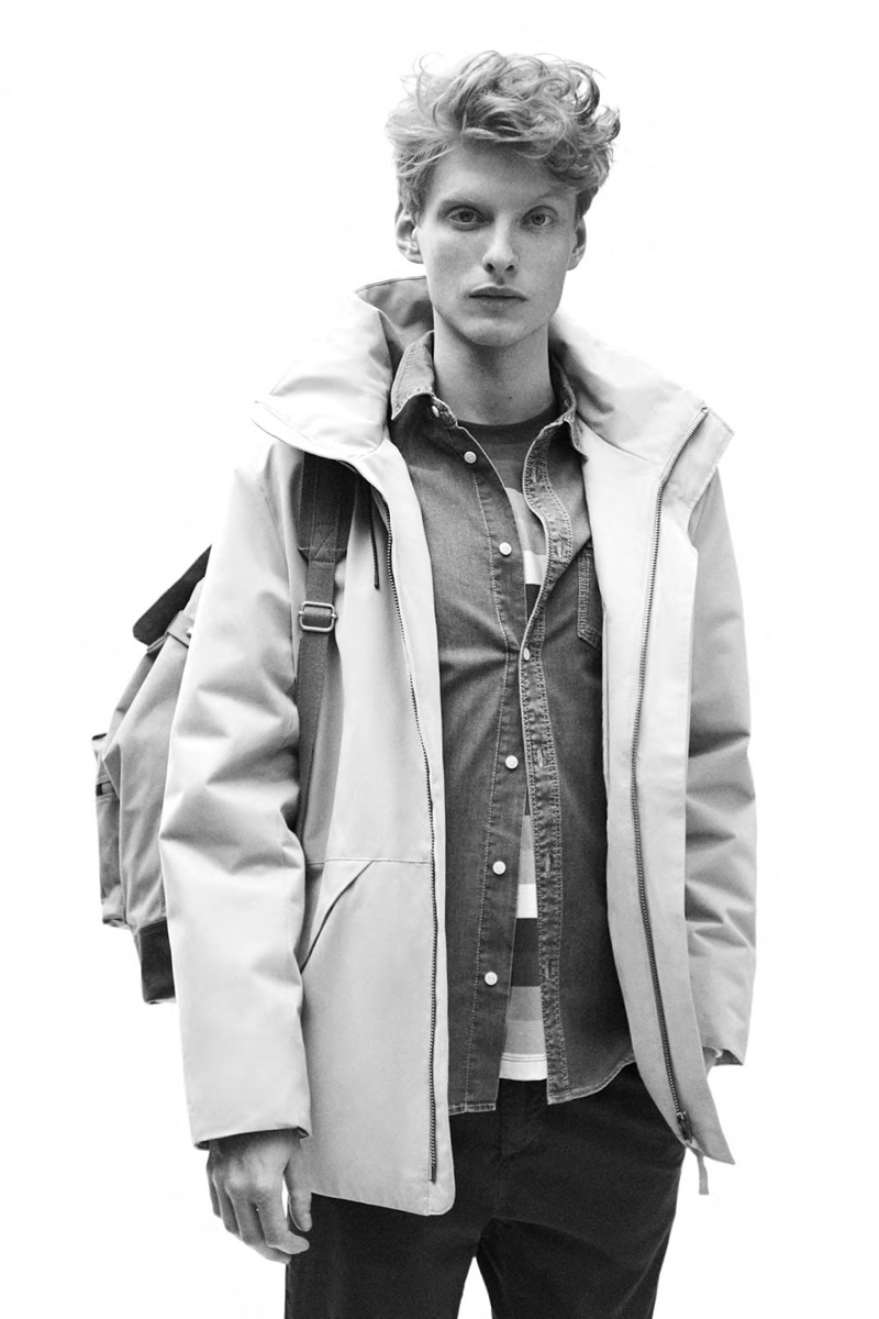 Sporting a hooded jacket, Iwan Zalewski models a look from Pepe Jeans.