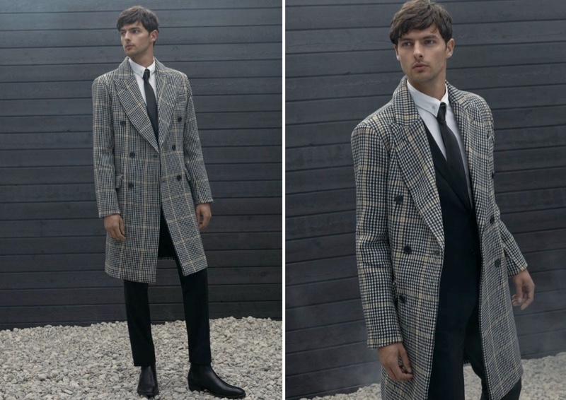 Embracing a sophisticated look, Hannes Gobeyn wears a LE 31 accent line houndstooth overcoat.