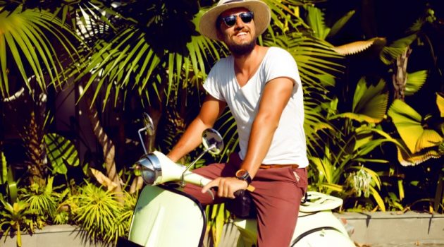 Why to Buy A Scooter Instead of A Second Car for City Commuting? Smiling Guy Tropical Outdoors Scooter Moped