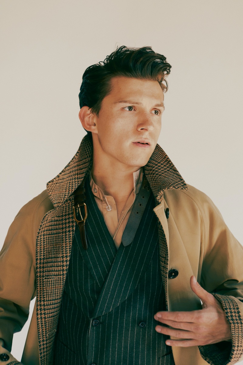 Front and center, Tom Holland sports a Ralph Lauren coat with a ISAIA vest and Rochas shirt for GQ Style USA.