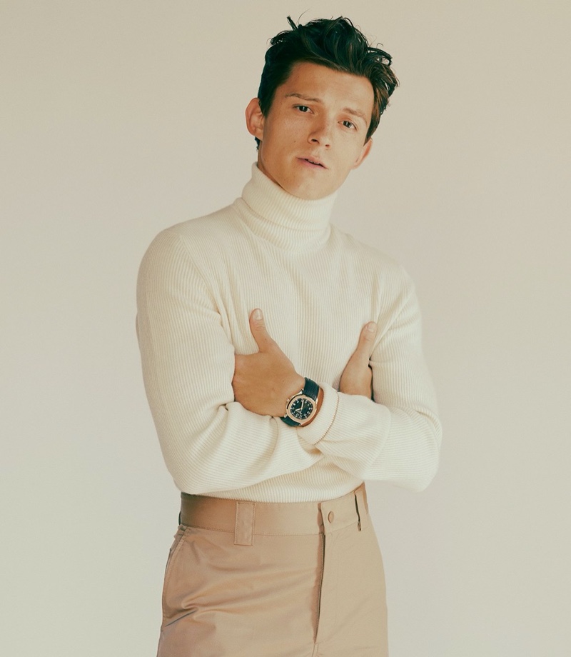 Actor Tom Holland wears a Brunello Cucinelli turtleneck and Valentino pants with his own Patek Philippe watch for GQ Style USA.