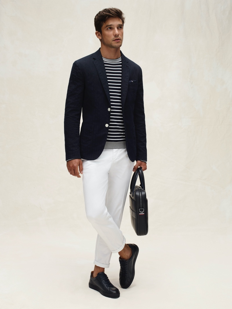 Alexis Petit makes a case for sophisticated nautical style in a striped top and blazer from Tommy Hilfiger's spring-summer 2020 collection.