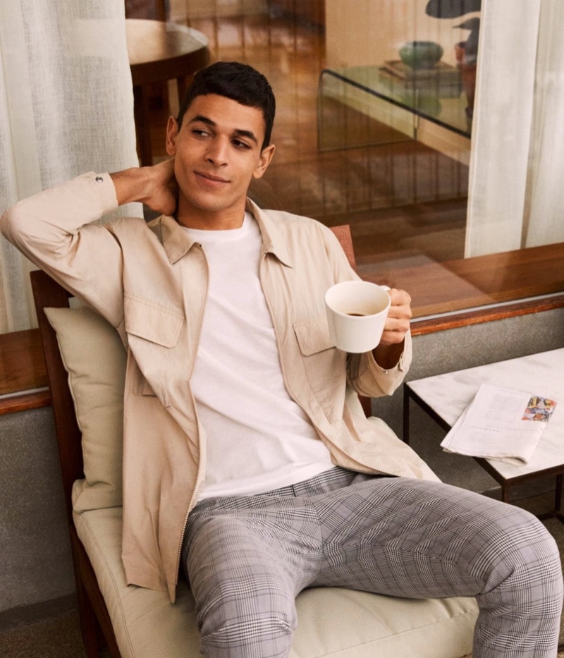 Ali Latif dons checked tailored joggers with a shirt jacket by H&M.