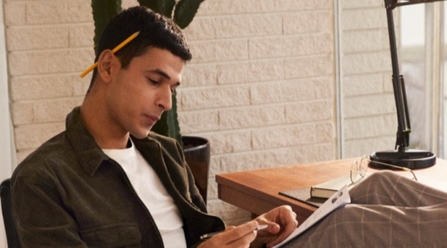 Ali Latif Makes a Case for H&M Tailored Joggers Embracing smart style, Ali Latif wears checked tailored joggers with a shirt jacket from H&M.