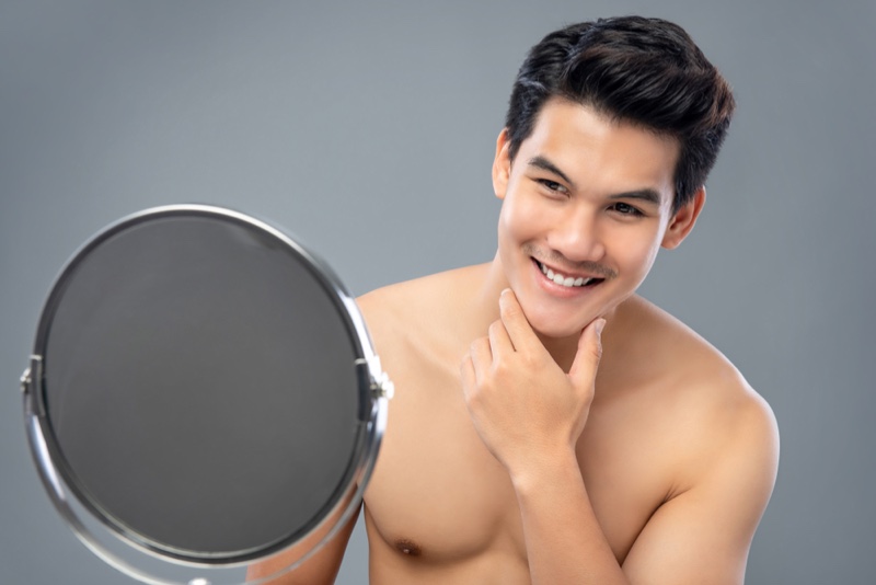 Asian Man Smiling Mirror Clear Skin