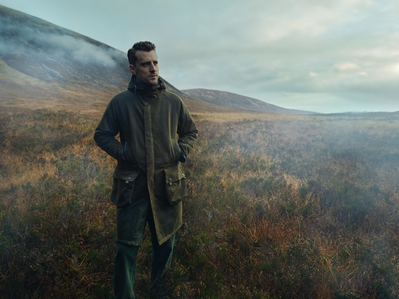 Pictured outdoors, George Barnett models a Barbour Gold Standard Supa-Hunting Wax jacket. » George Barnett Sports Barbour Gold Standard Fall '20 Collection Pictured outdoors, George Barnett models a Barbour Gold Standard Supa-Hunting Wax jacket.