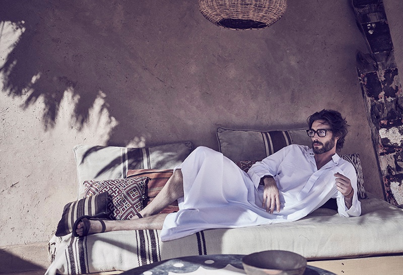 Donny wears kaftan Billionaire Dubai, glasses Cutler & Gross, leather bracelet Hermès, and sandals Yves Saint Laurent.